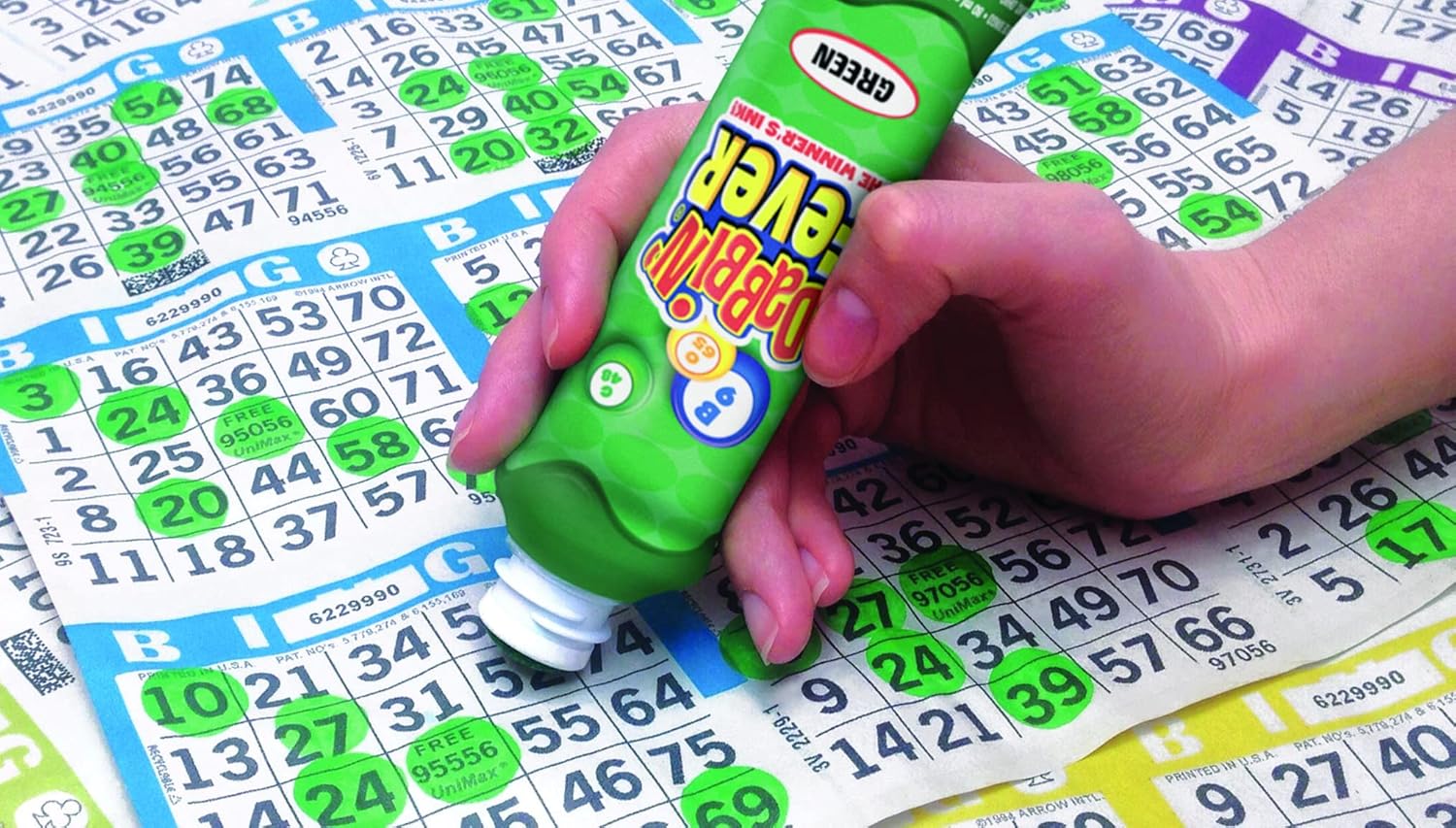 A bingo dauber marking a card